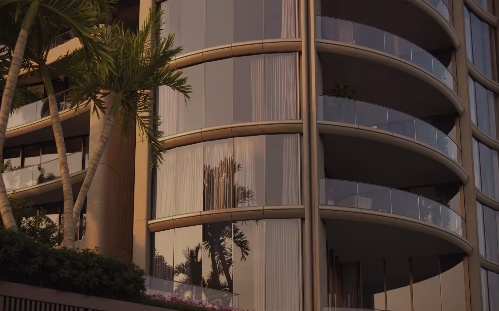 Curved tower facade framed by palms