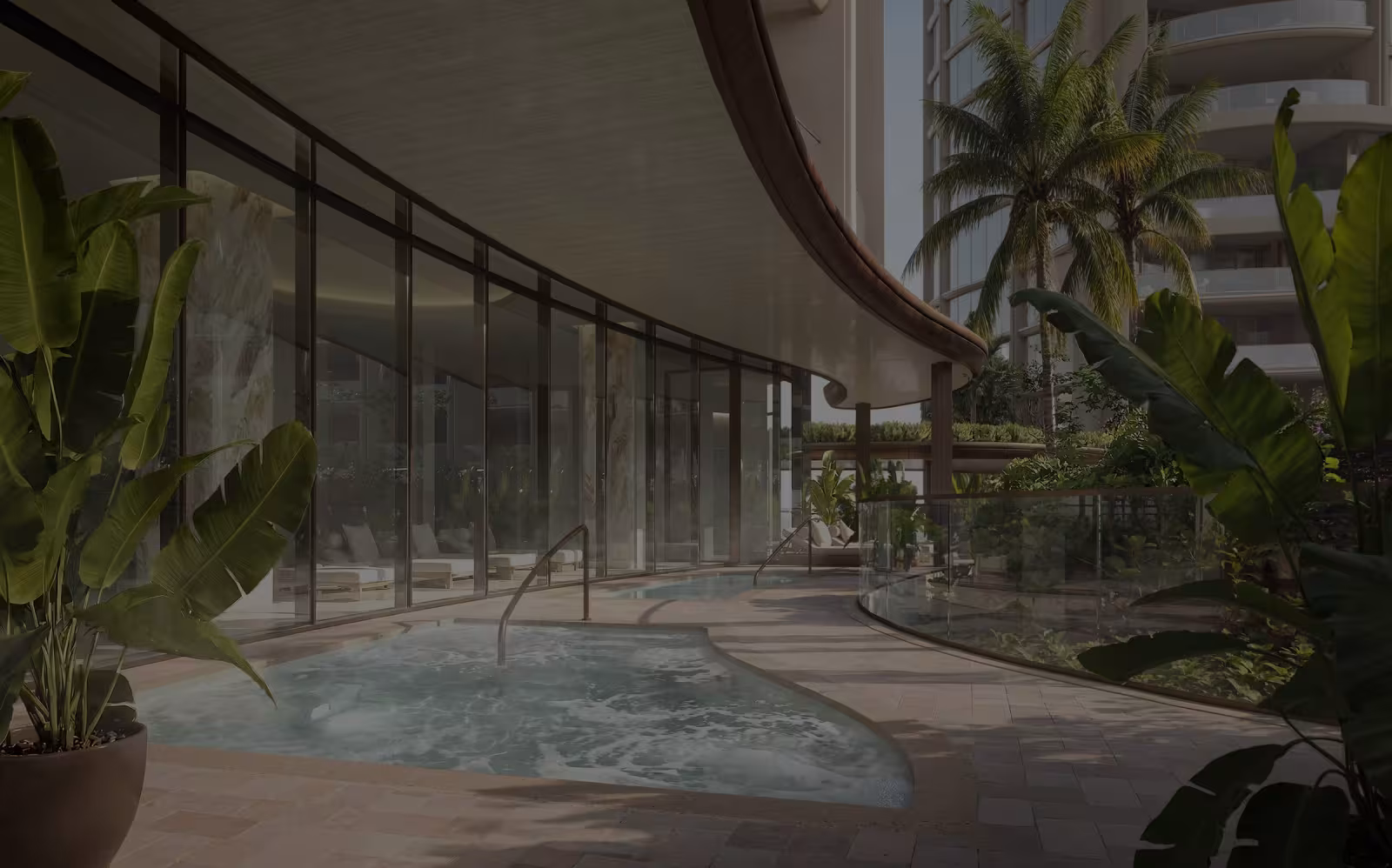 Covered waterfront terrace with a reflecting pool